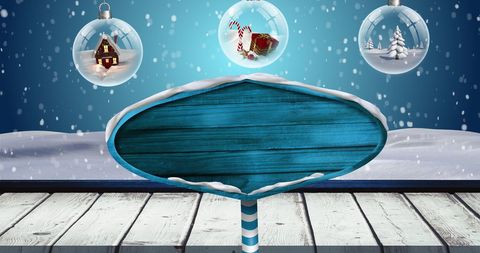 Festive Blue Wooden Sign with Snow and Christmas Baubles