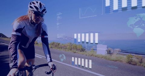 Female cyclist riding coastal road with augmented reality fitness data and performance hud
