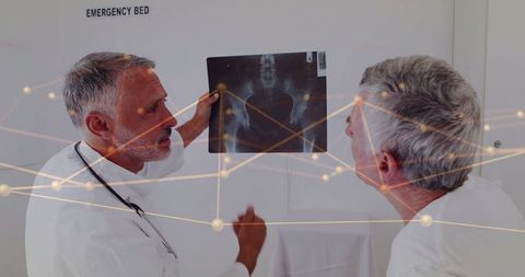 Doctors Analyzing X-Ray with Digital Network Overlay