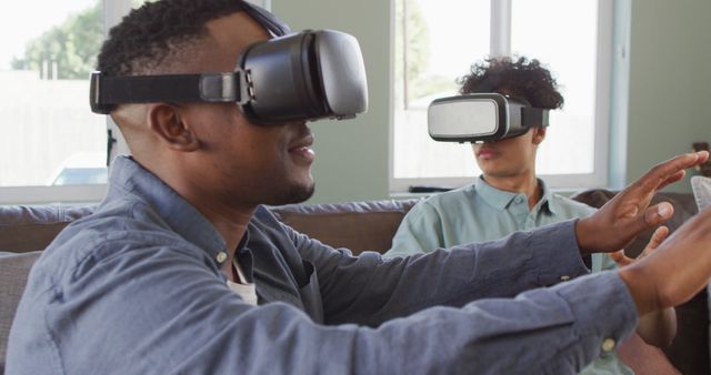 Two Young Men Experiencing Virtual Reality at Home - Download Free Stock Images Pikwizard.com
