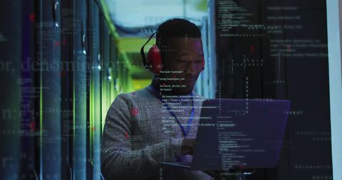 African American Engineer Analyzing Data in Server Room - Download Free Stock Images Pikwizard.com