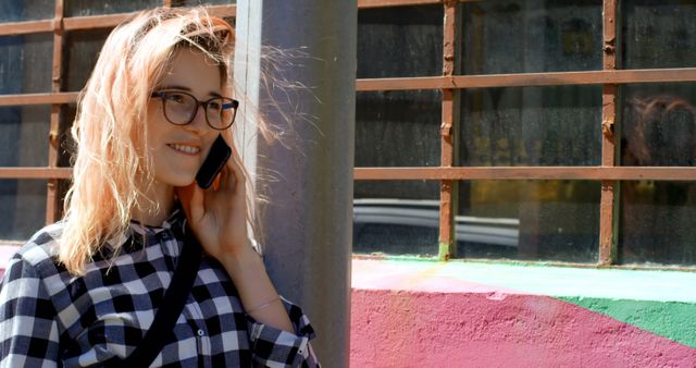 Smiling Woman with Glasses Talking on Phone Outdoors - Download Free Stock Images Pikwizard.com