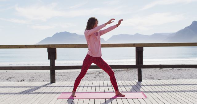 Woman Practicing Yoga on Beachfront Deck - Download Free Stock Images Pikwizard.com