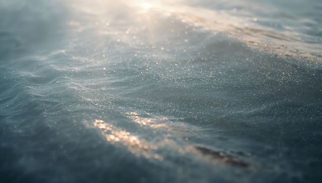 Sunlit Ocean Waves Glittering at Golden Hour