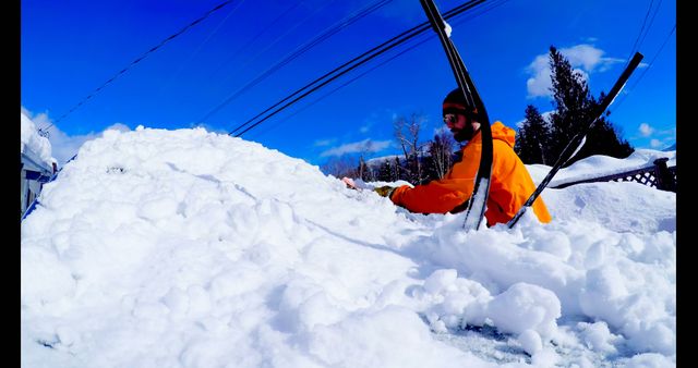 Person Removing Snow from Vehicle on Bright Winter Day - Download Free Stock Images Pikwizard.com