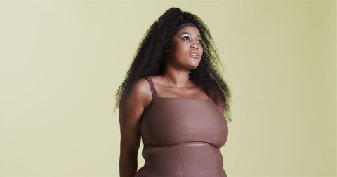 Confident African American Woman in Activewear Embracing Strength