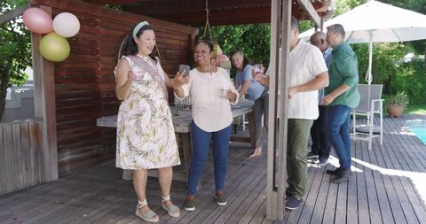 Joyful Seniors Celebrating Together at Outdoor Garden Party