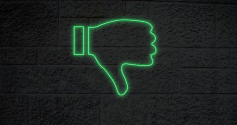 Glowing Neon Thumbs Down on Brick Wall - Download Free Stock Images Pikwizard.com