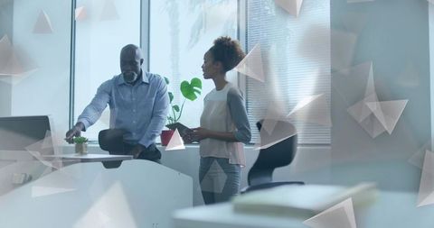 Colleagues Collaborating at Modern Office Reception Desk