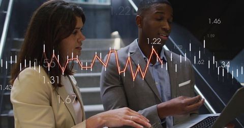 Business partners analyzing financial data on laptop with overlaid trading chart and strategy metric