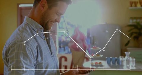 Smiling Man Analyzing Chart Data on Smartphone in Cafe with Warm Lighting