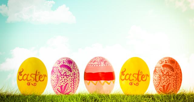 Digital composite of Easter eggs in front of blue sky