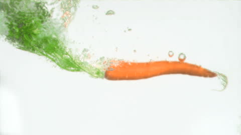 Carrot Plunging into Water in Slow Motion for Freshness Concept