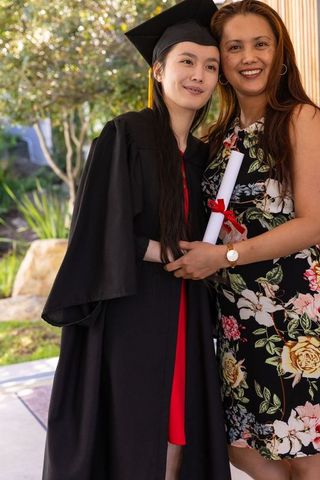Mother and Daughter Celebrating Graduation, Joyful Achievement