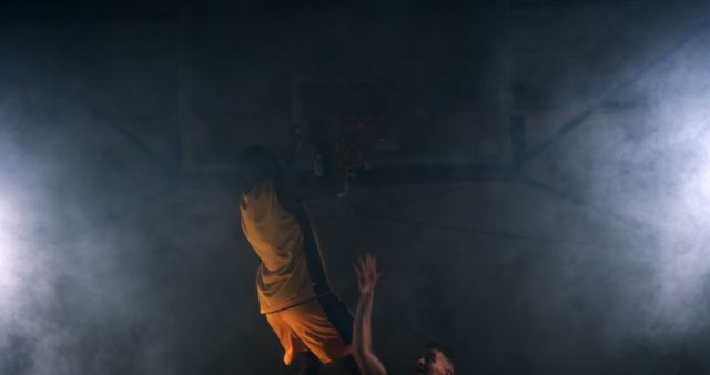 Intense Basketball Dunk in Dramatic Smoke-filled Arena - Download Free Stock Images Pikwizard.com