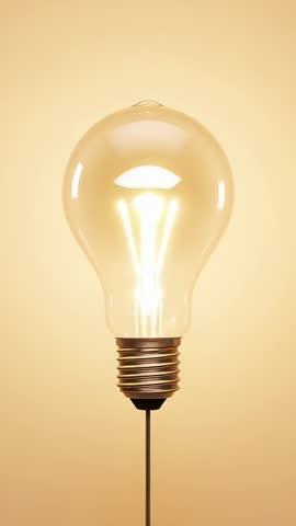 Power flowing through cord igniting glowing incandescent bulb in vertical video