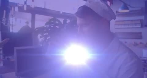 Chef Experiencing Light Beam While Using Laptop in Modern Kitchen