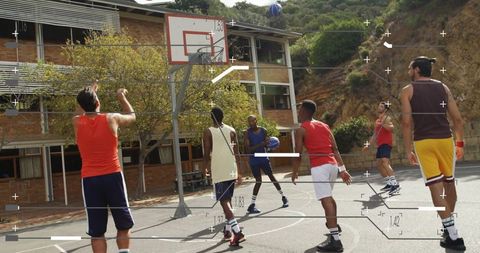 Players Engaging in Energetic Basketball Game on School Court