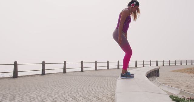 Woman Exercising Outdoors Wearing Headphones and Activewear - Download Free Stock Images Pikwizard.com