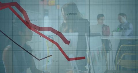 Business team analyzing declining financial chart overlay in modern office collaboration