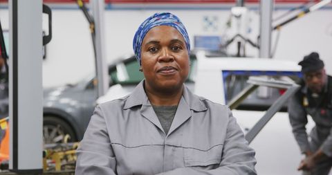 Confident African American Female Mechanic in Workshop - Download Free Stock Images Pikwizard.com