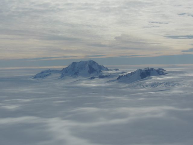 Mountains seen from the IceBridge DC-8 during a survey of the Getz Ice Shelf on Oct. 27, 2012.  Credit: NASA / Christy Hansen  NASA's Operation IceBridge is an airborne science mission to study Earth's polar ice. For more information about IceBridge, visit: <a href="http://www.nasa.gov/icebridge" rel="nofollow">www.nasa.gov/icebridge</a>  <b><a href="http://www.nasa.gov/audience/formedia/features/MP_Photo_Guidelines.html" rel="nofollow">NASA image use policy.</a></b>  <b><a href="http://www.nasa.gov/centers/goddard/home/index.html" rel="nofollow">NASA Goddard Space Flight Center</a></b> enables NASA’s mission through four scientific endeavors: Earth Science, Heliophysics, Solar System Exploration, and Astrophysics. Goddard plays a leading role in NASA’s accomplishments by contributing compelling scientific knowledge to advance the Agency’s mission.  <b>Follow us on <a href="http://twitter.com/NASA_GoddardPix" rel="nofollow">Twitter</a></b>  <b>Like us on <a href="http://www.facebook.com/pages/Greenbelt-MD/NASA-Goddard/395013845897?ref=tsd" rel="nofollow">Facebook</a></b>  <b>Find us on <a href="http://instagrid.me/nasagoddard/?vm=grid" rel="nofollow">Instagram</a></b>