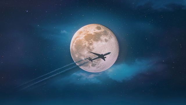 Jet Soaring Across Moonlit Sky with Stellar Backdrop