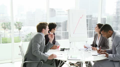 Successful Business Professionals Analyzing Growth Graph