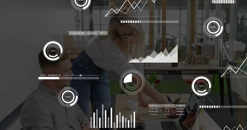 Woman designer pointing while collaborating with coworker over laptop analyzing HUD data