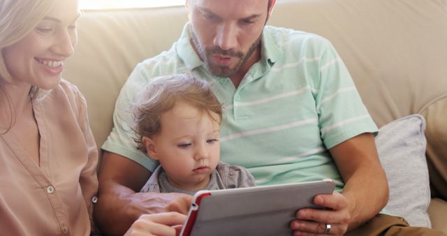 Happy Family Using Tablet on Couch - Download Free Stock Images Pikwizard.com