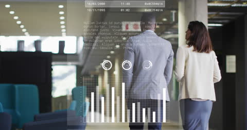 Business Colleagues Analyzing Digital Data in Modern Office