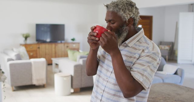 Senior Man Enjoying Hot Beverage in Cozy Living Room - Download Free Stock Images Pikwizard.com