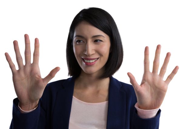 Asian businesswoman engaging with invisible screen, showcasing futuristic technology and innovation. Ideal for use in business, technology, and corporate presentations, as well as marketing materials highlighting modern digital solutions and professional environments.