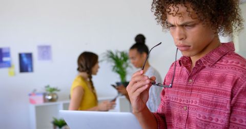 Young professional focused on creative digital work environment