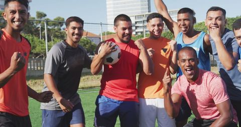 Joyful Male Soccer Team Celebrating Victory on Field - Download Free Stock Images Pikwizard.com
