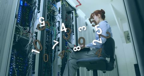 Woman monitoring server room with digital interface overlay