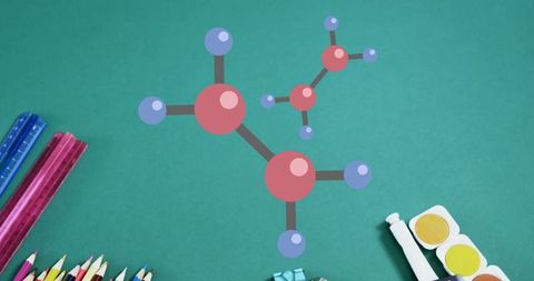 Colorful 3D Molecular Model with School Supplies on Green Table