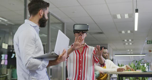 Employees Exploring Virtual Reality in Modern Office - Download Free Stock Images Pikwizard.com