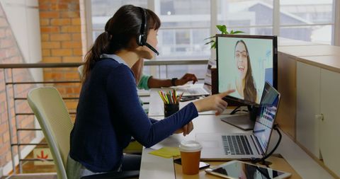 Young Professionals Engaged in Online Meeting in Modern Office - Download Free Stock Images Pikwizard.com