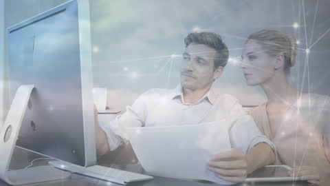 Caucasian Couple Managing Finances with Computer and Technology Overlay