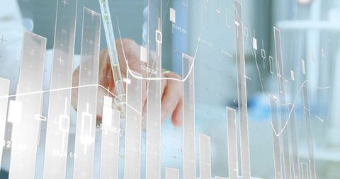 Senior male hand tracing holographic candlestick charts with stylus over office desk
