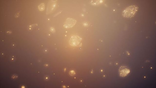 Floating glowing particles in cosmic amber-mauve gradient