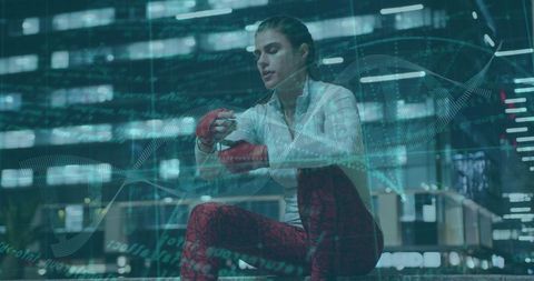 Female Athlete Preparing for Boxing in Urban Environment at Night