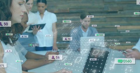 Hispanic Woman Analyzing Data on Laptop Surrounded by Modern Team