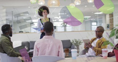 Diverse Team in Office Surrounded by Digital Data Visuals