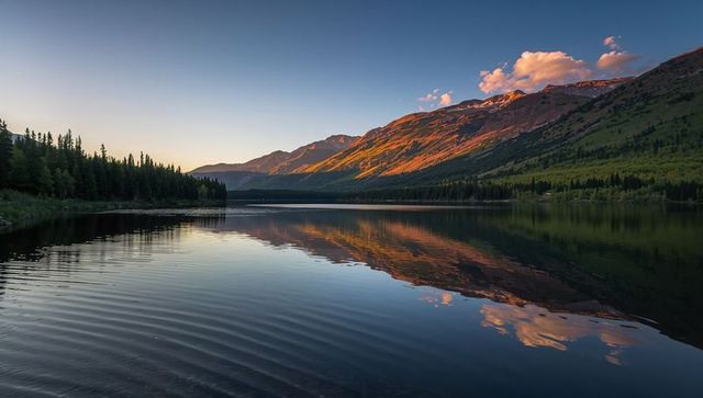 Alpenglow Reflecting on Calm Alpine Lake with Pine Peninsula at Dusk — Mountain Mirror Panorama