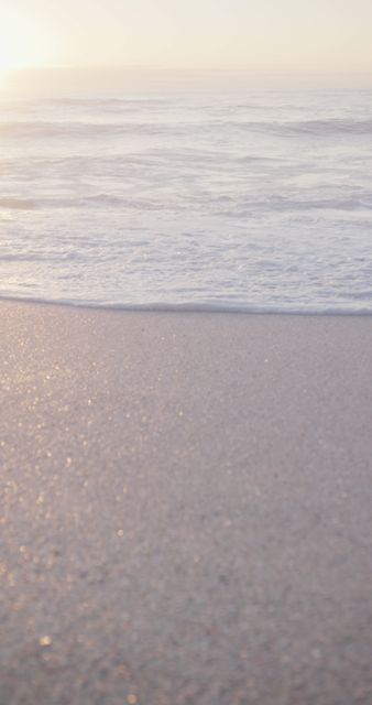 Serene Seashore with Gentle Waves and Clear Sky - Download Free Stock Images Pikwizard.com