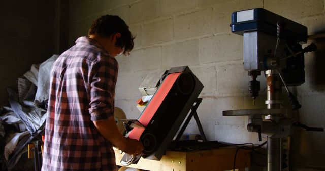 Person Working with Sanding Machine in Workshop - Download Free Stock Images Pikwizard.com