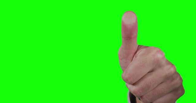 Close-up of Hand Giving Thumbs Up on Green Background - Download Free Stock Images Pikwizard.com