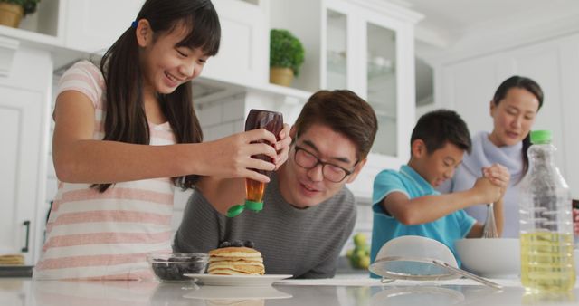 Happy Family Making Pancakes Together in Modern Kitchen - Download Free Stock Images Pikwizard.com